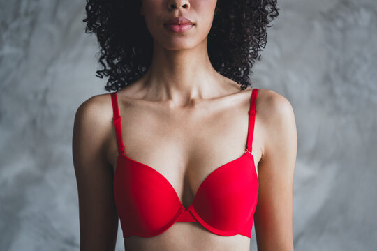 Cropped photo of attractive young girl breast bra shopping wear red fashion lingerie isolated concrete wall background no filter