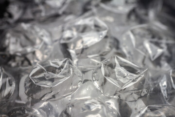 Extreme macro of plastic bubble wrap texture. Selective soft focus, shallow depth of field. Abstract dreamy background