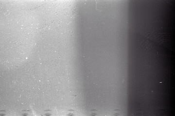 Obraz premium Blank grained film strip texture background with heavy grain, dust and light leak