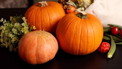 Pumpkins, peppers, corn evoke vibrant harvest scene. Cozy seasonal atmosphere with rustic charm enhances autumn gatherings, creating festive decor, ideal for fall harvest setup.