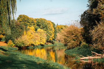 Golden autumn landscape with reflection in the river, Brest Fortress
