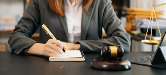 justice and law concept. Male judge in a courtroom the gavel, working