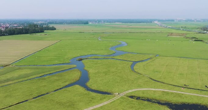 Aerial view of meadow bird reserve Oosterveld with water and grasslands, Limmen, Netherlands.