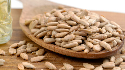 peeled sunflower seeds on a wooden background