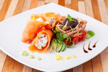 food presentation mixed fresh fish with vegetables and creative garnish