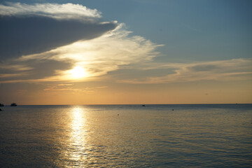 A serene sunset over the tranquil ocean.