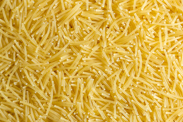 Uncooked Filini Pasta: A Culinary Canvas of Noodles, Creating a Lively and Textured Background for Gourmet Cooking. Dry Pasta. Raw Macaroni - Top View, Flat Lay