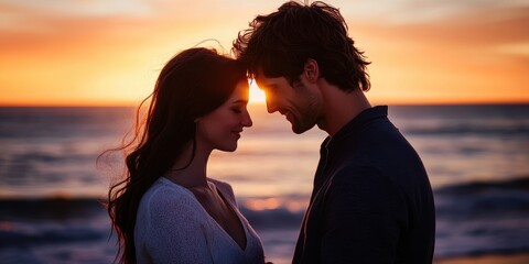 Fototapeta premium Silhouettes of a couple in love at sunset.