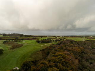 Dramatic clouds gathering over golf course near teignmouth, uk