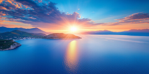 Fototapeta premium Sun setting over calm water, casting warm colors and reflections. Great for themes of serenity, travel, and nature’s beauty.
