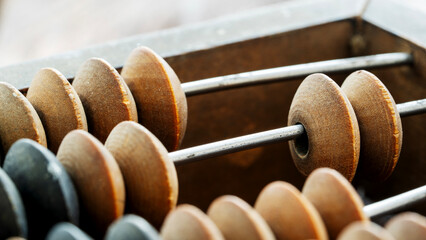 vintage abacus on wooden background