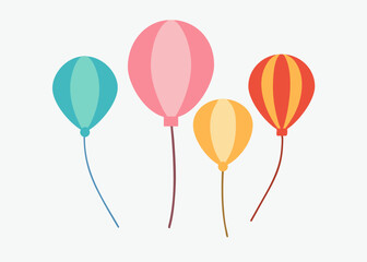 Four colorful balloons with long strings. The balloons are in different colors and sizes, and they are all floating in the air. Concept of joy and celebration