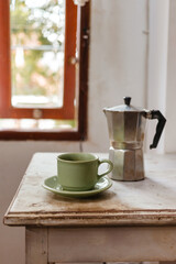 Hot coffee from the coffee maker in the morning. Making espresso in a moka pot.