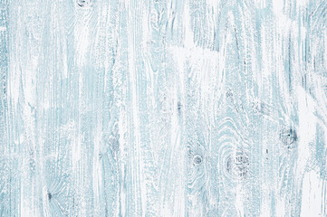 Light blue wooden background in a cool tone. Wood texture with vertical stripes and knots for...