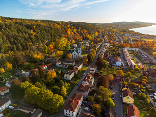 Gränna church in Sweden, autumn colors, at sunset, aerial view. Beautiful small swedish town.
