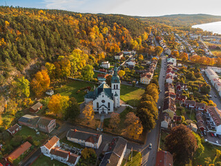 Gränna church in Sweden, autumn colors, at sunset, aerial view. Beautiful small swedish town.