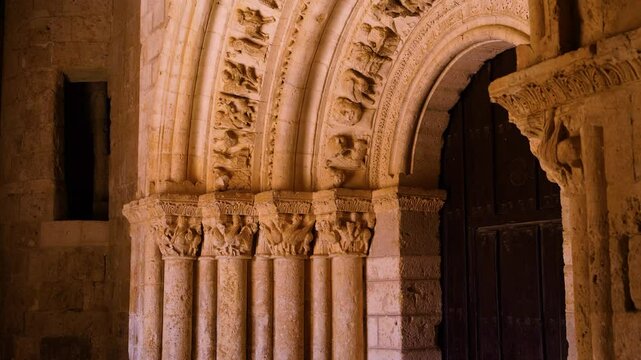 Romanesque arch portico of the Church of San Esteban Protom&aacute;rtir in the village of Hormaza. Region of Alfoz de Burgos. Province of Burgos. Castile and Leon. Spain. Europe