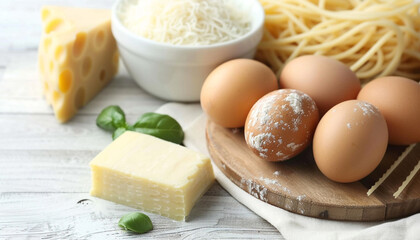 Fototapeta premium Ingredients for lasagne on white wooden table, close-up, homemade food illustration. Italian cuisine.