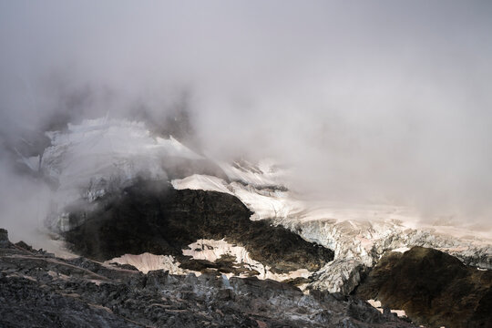 View of majestic Fee Glacier surrounded by rugged mountains and snow, Saas Fee, Switzerland.