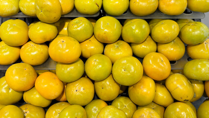 Sweet persimmon at the market stall