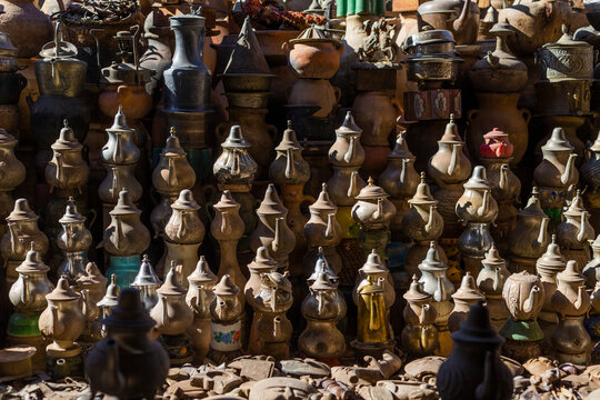 View of colorful traditional ceramics and pottery in a vibrant marketplace, Ouarzazate, Morocco.