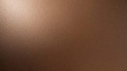 Fototapeta premium Bronze surface with a textured finish, reflecting a sleek and sophisticated style perfect for contemporary aesthetics.