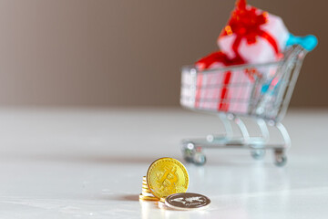 Golden Coins in Foreground With Shopping Cart Full of Gifts in Background