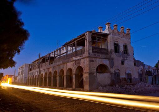 A Car Passing By A Former Ottoman Empire House By Night, Berbera, Somaliland