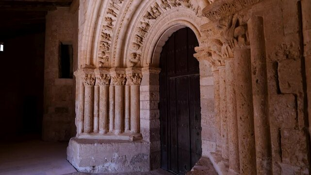 Romanesque arch portico of the Church of San Esteban Protom&aacute;rtir in the village of Hormaza. Region of Alfoz de Burgos. Province of Burgos. Castile and Leon. Spain. Europe