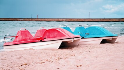 Pedal Boat Water Bikes Parked on Seashore Beach Sand