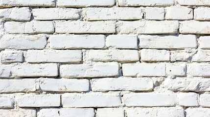 A weathered white brick wall creates a rustic architectural surface with repeating patterns for an urban background in commercial projects.