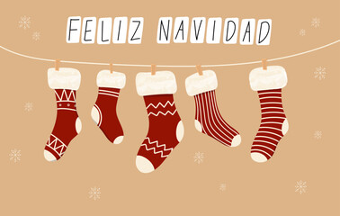 Hanging Christmas stockings on rope with cute xmas patterns. Feliz Navidad Hanging Christmas Stockings on rope.