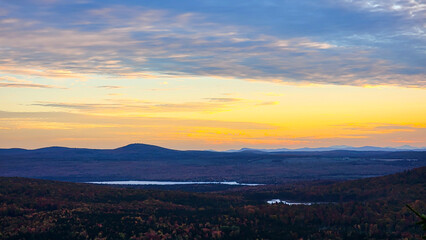 Beautiful colorful sunset over the mountains in autumn, fall foliage 