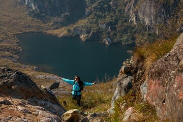 Woman overlooking heart-shaped lake