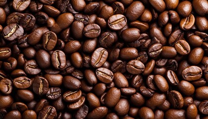 Fototapeta premium Close-up view of roasted coffee beans, showcasing rich textures and shades of brown, perfect for coffee lovers.
