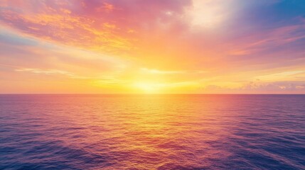 Obraz premium Vibrant Ethereal Sky Over Tranquil Sea, A panoramic view of a stunning sunset with rich purple, orange, and yellow hues, creating a dreamy and uplifting atmosphere.