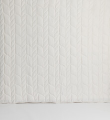 Quilted White Fabric with Vertical Chevron Pattern