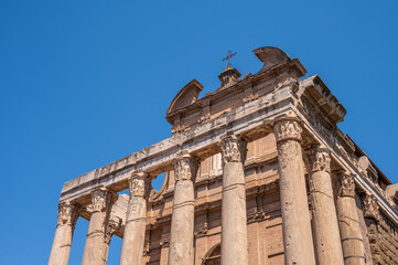 Naklejka premium Ruins of the Antoninus and Faustina Temple inside the Roman Forum.