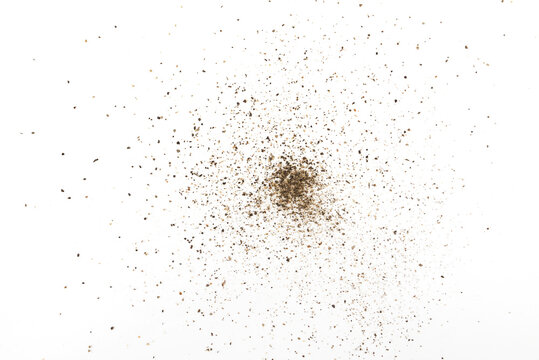 Black ground pepper scattered, spice flying isolated on white, clipping path