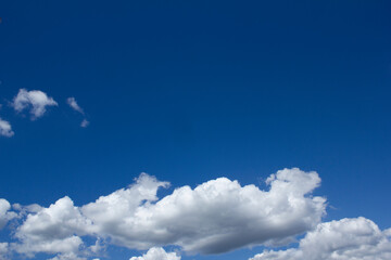 
Blue sky with puffy clouds