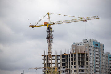 A crane is lifting a building under construction