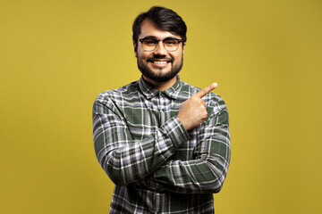 man smiling and pointing to the side
