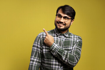 man looking to the side and pointing with his left hand