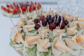 a food an snacks on the buffet table at the celebration of wedding birthday