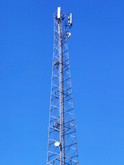 radio communication antenna on blue sky background