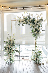 arch for the wedding ceremony on the terrace in the photo zone restaurant