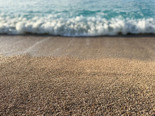 Crashing wave on a pebble beach