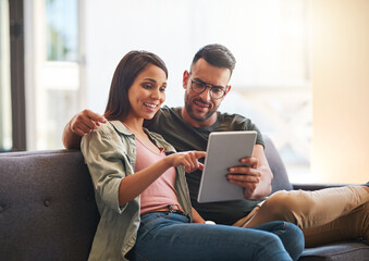 Happy, couple and relax with tablet at house for financial planning, loan research and mortgage...