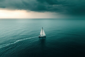 Obraz premium A Single Sailboat Navigating Calm Waters Under a Stormy Sky