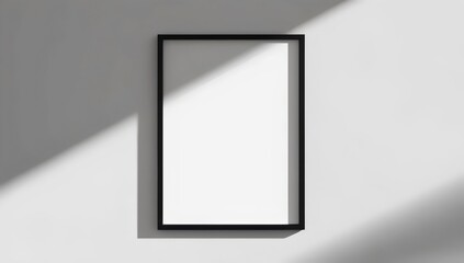 Sleek modern minimalist white blank poster with thin black border on a light gray wall, symbolizing a blank canvas, mockup frame.